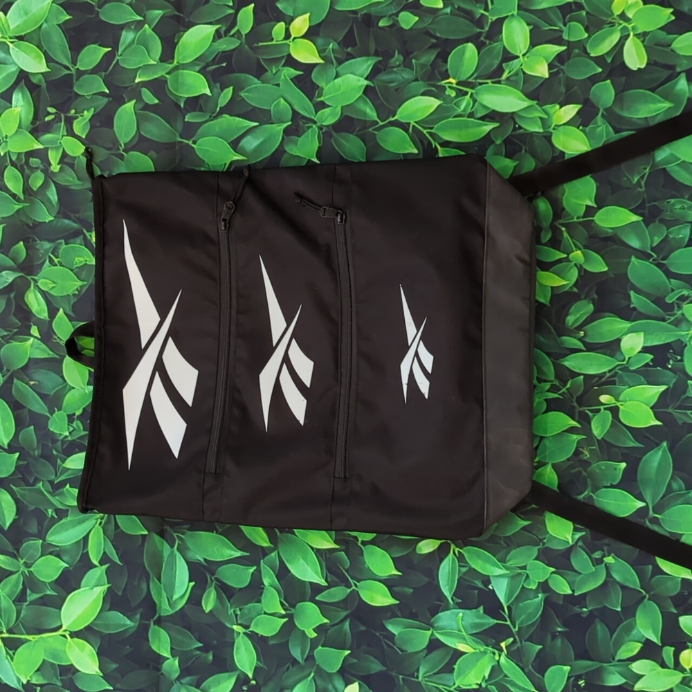 Black Reebok Backpack With Unique Tiered Zipper Pocket Design - Picture 2 of 15